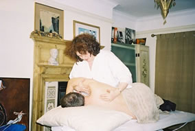 Osteopath Working On Patient Photo